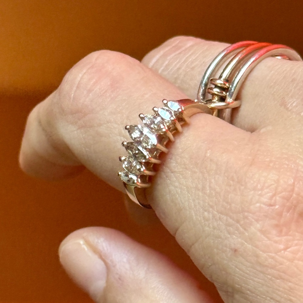 14K solid yellow gold ring with 7 marquise natural diamonds. Size 9